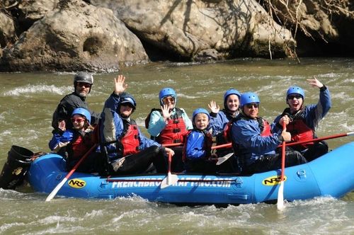 Waving rafters on river