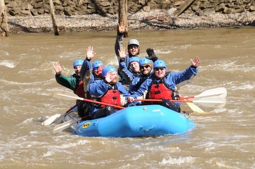 Happy group of rafters waving