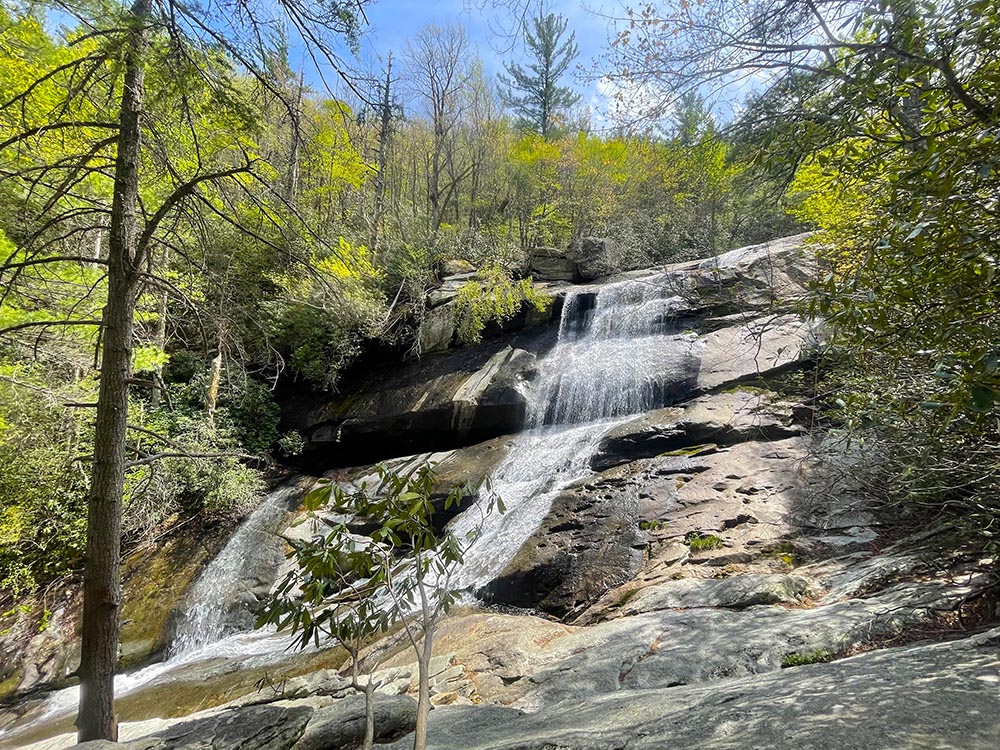 View from the base of a waterfall where canyoneering trips take place with French Broad Adventures in Western North Carolina.