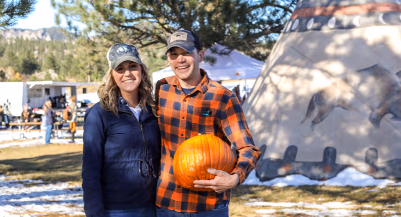 couple pumpkin picking 