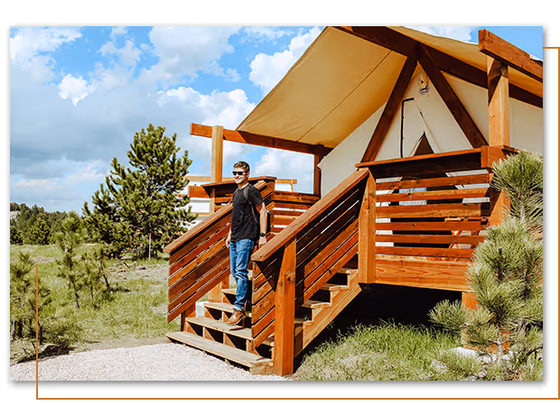 person walking out of moonlight ridge cabin