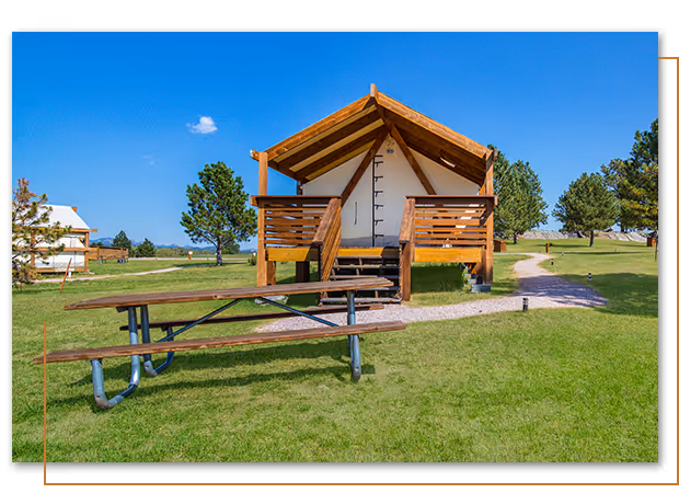 outside view of Poplars Edge glamping tent at Buffalo Ridge Camp Resort in Custer, SD