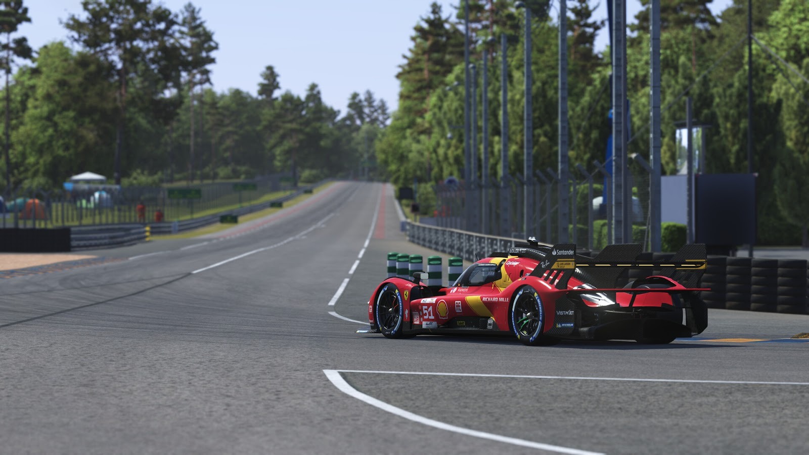 A red Le Mans Hypercar racing around a track.