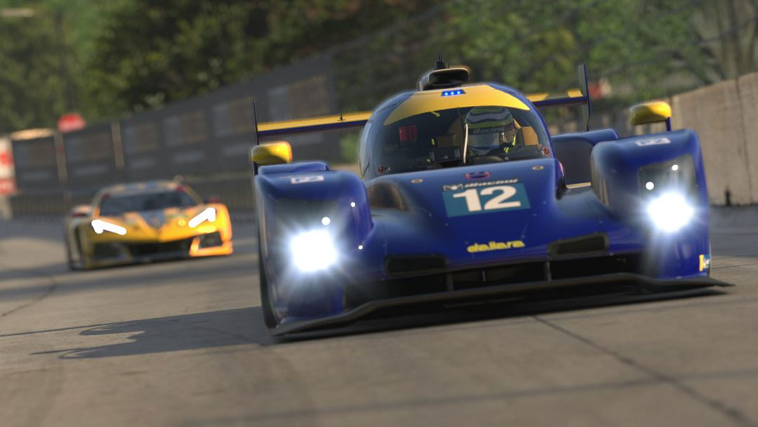 Race car leading on a track.