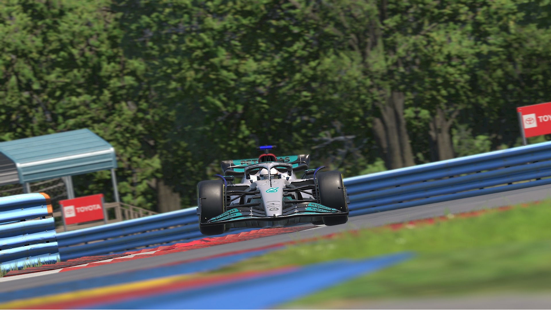 A race car driving at high speed on a racetrack