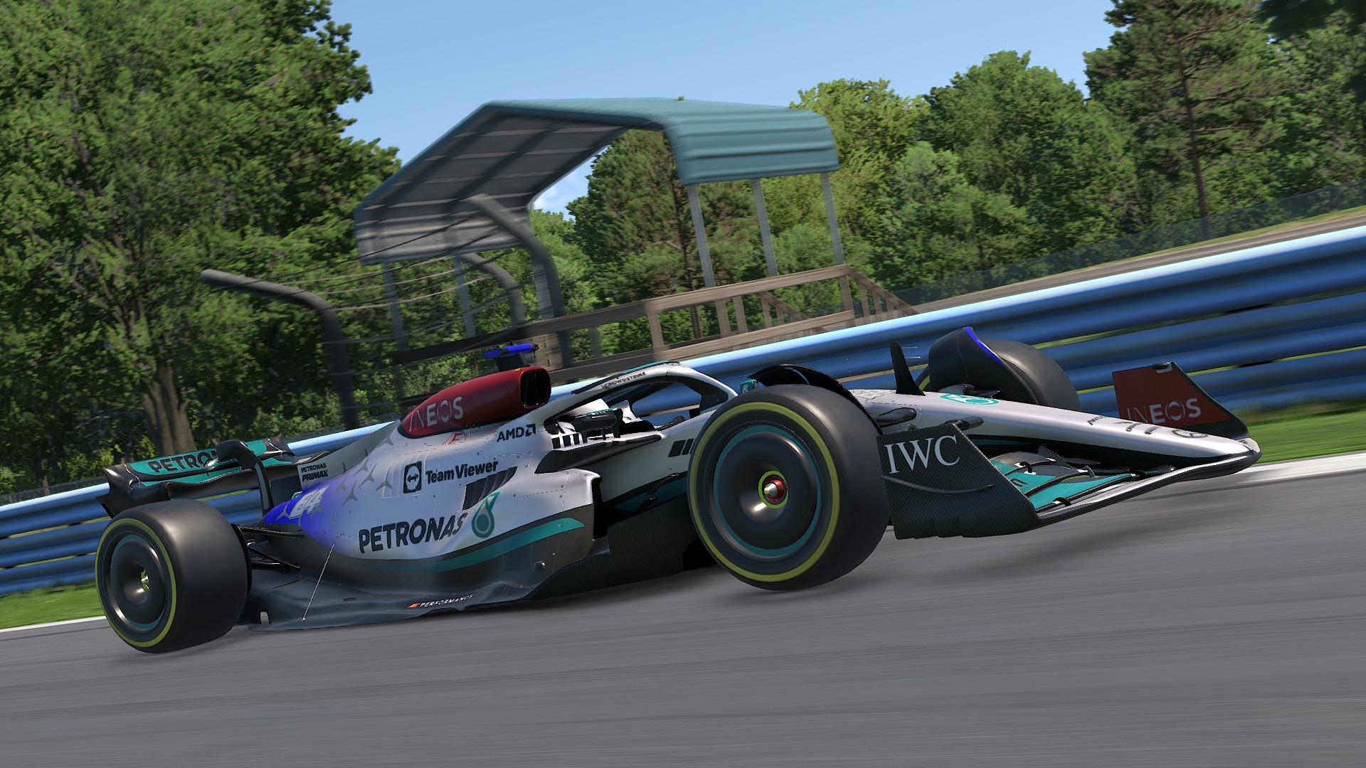 A race car driving at high speed on a racetrack