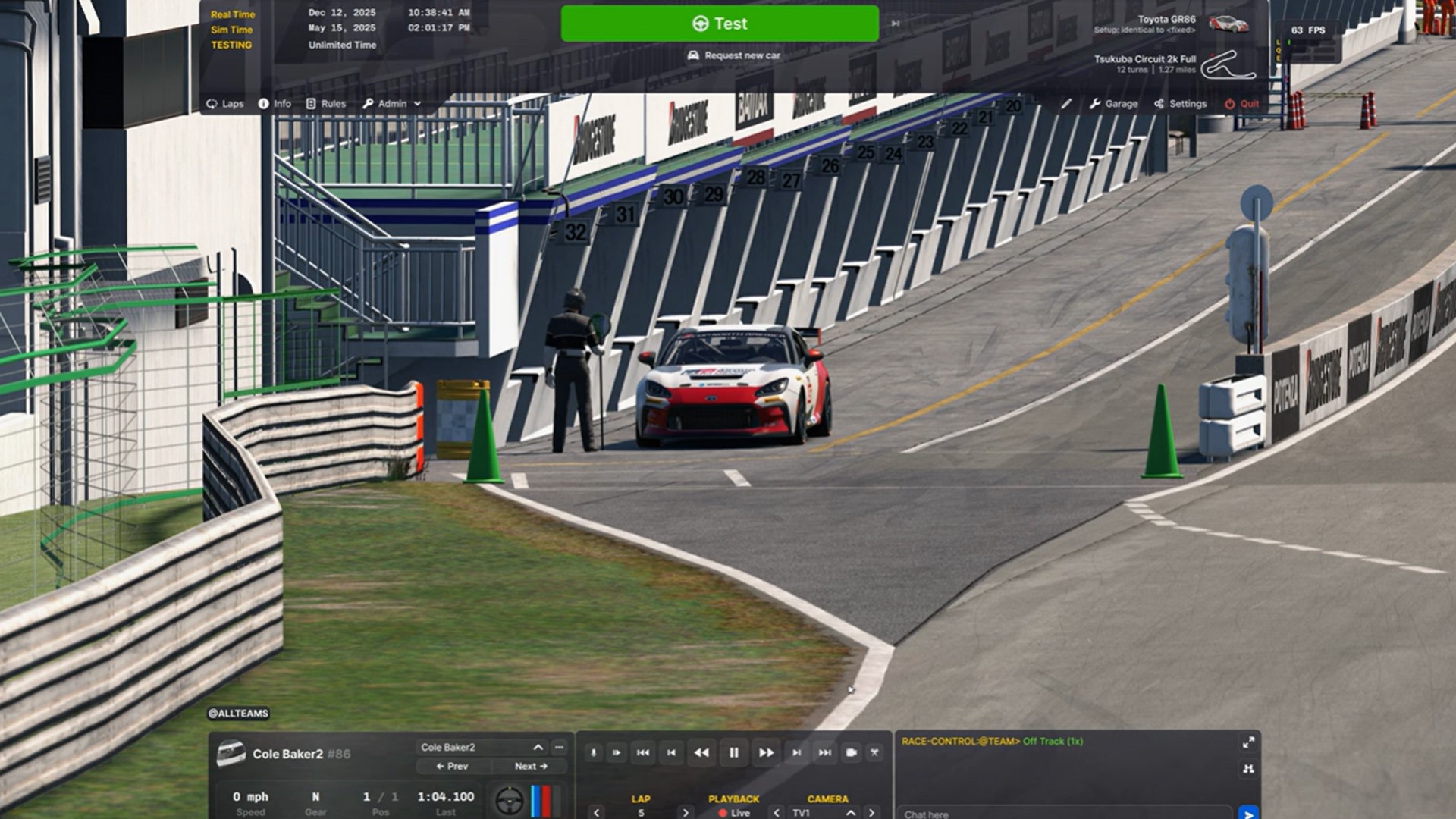 a car leaving the pit lane during a practice session at a race circuit.