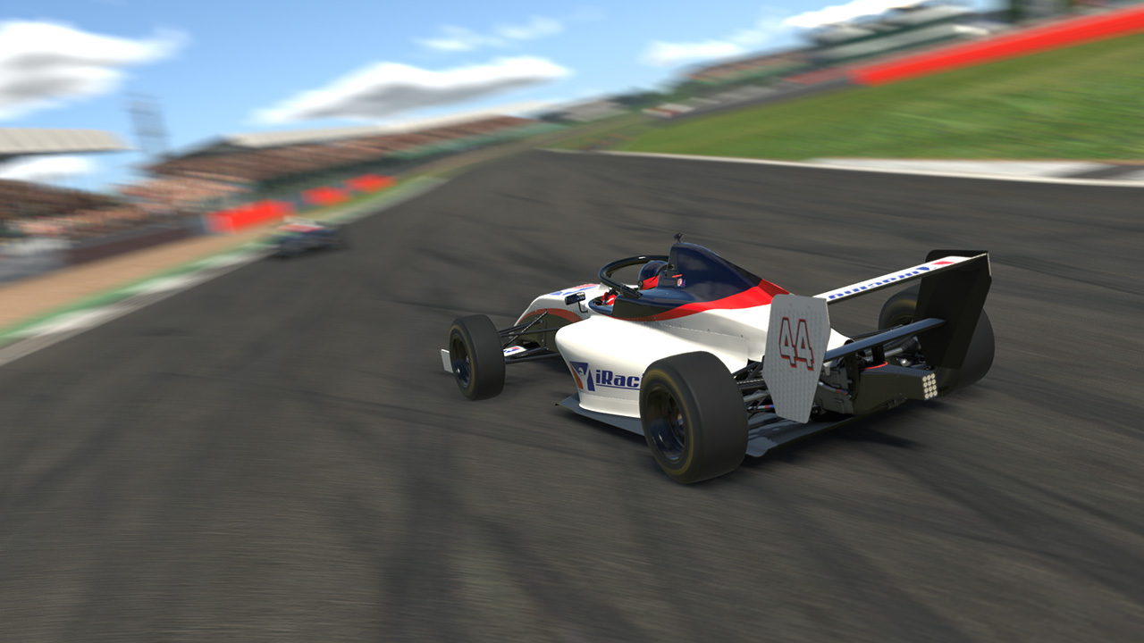 Open-wheel race car driving on track in iRacing