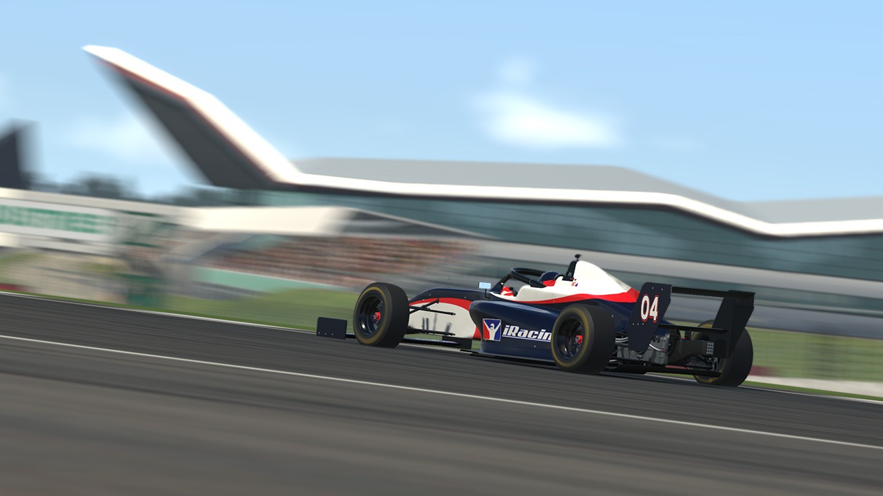 FIA F4 open-wheel race car driving on track in iRacing