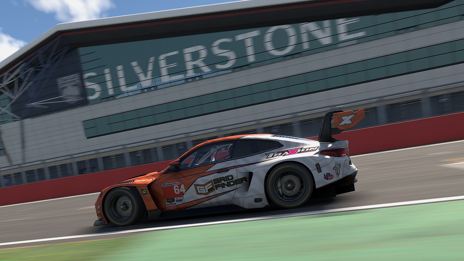 GT3 car racing past the Silverstone building in iRacing