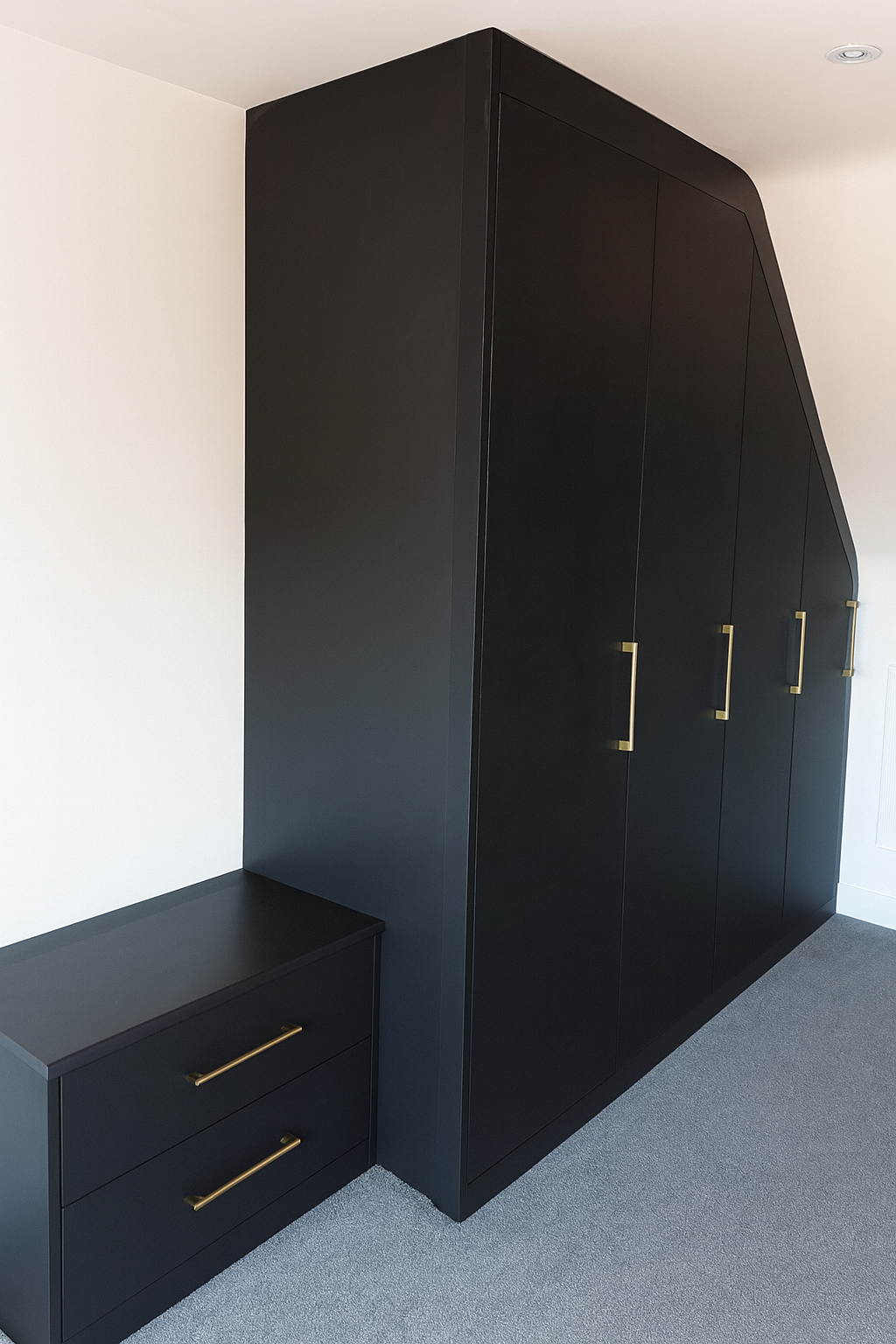 large green fitted corner wardrobe with drawers