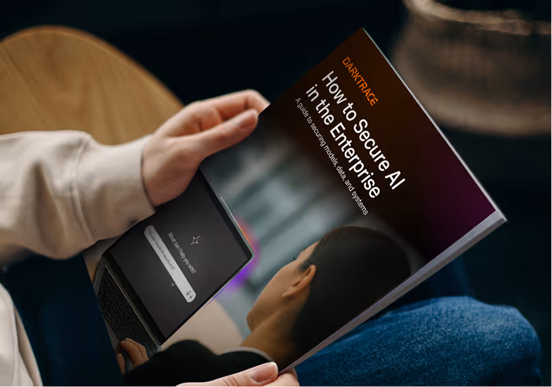 Image of person holding a book about securing ai in the enterprise
