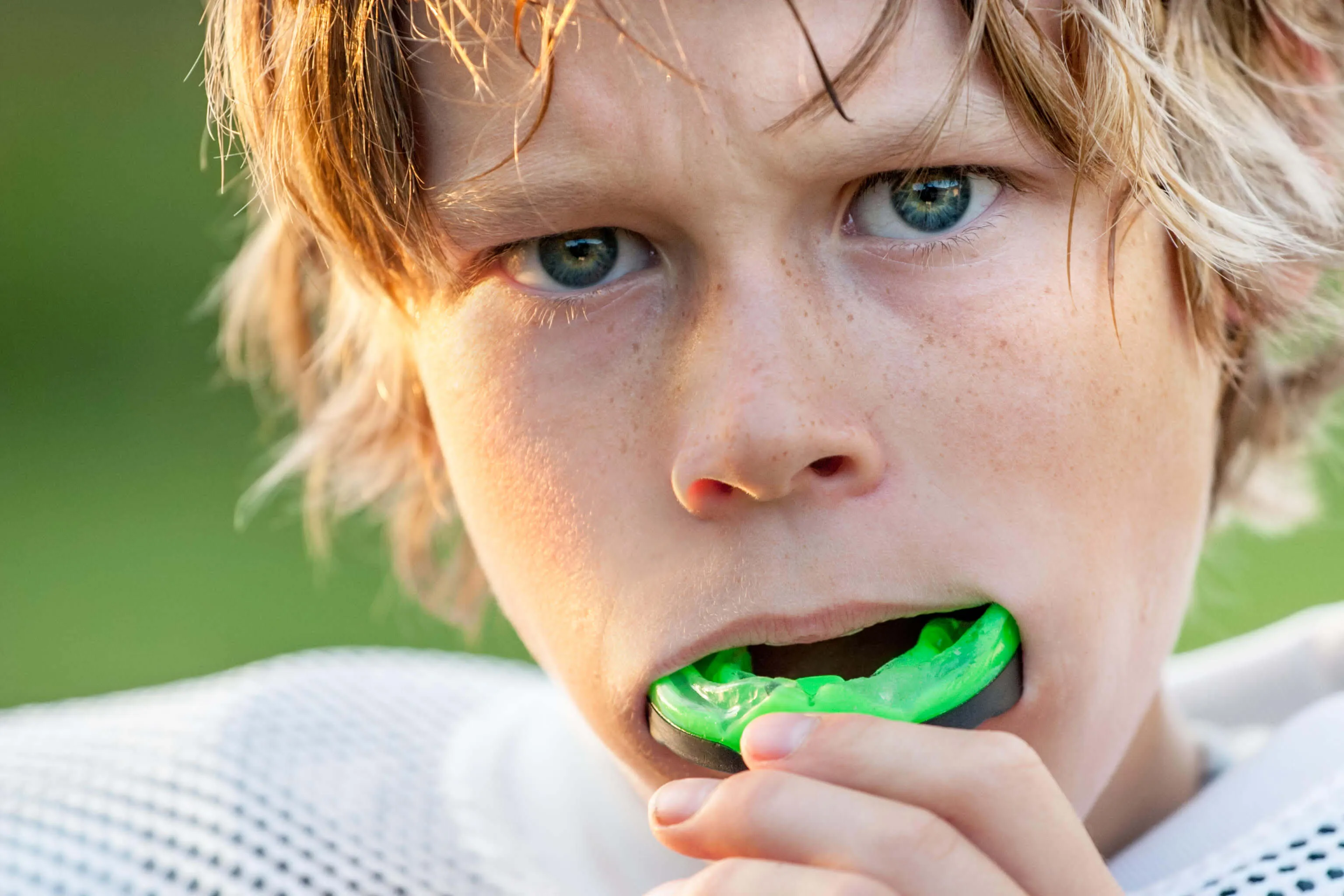 Student athlete wearing a mouthguard 