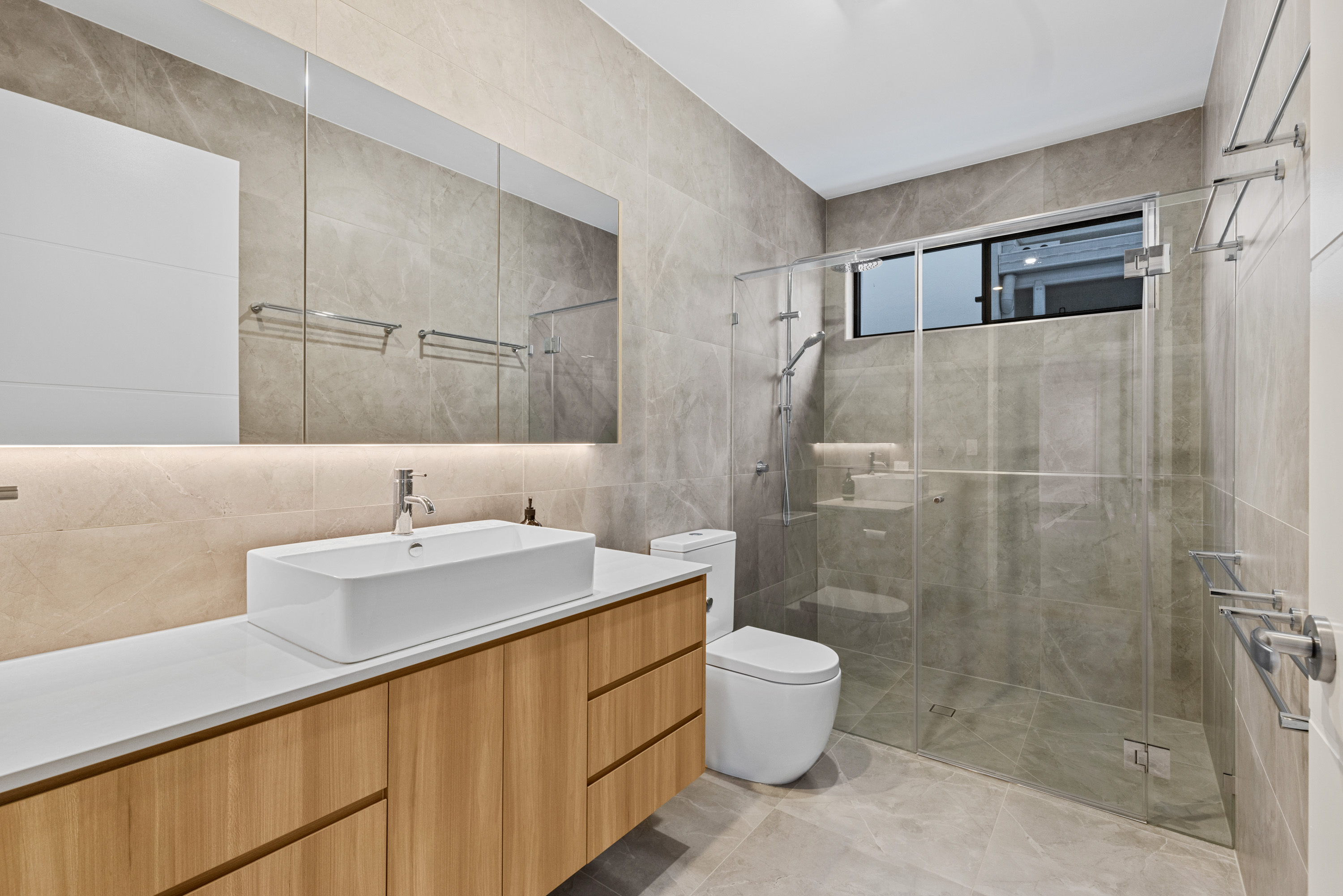 Modern bathroom with timber vanity, bathtub and walk-in shower