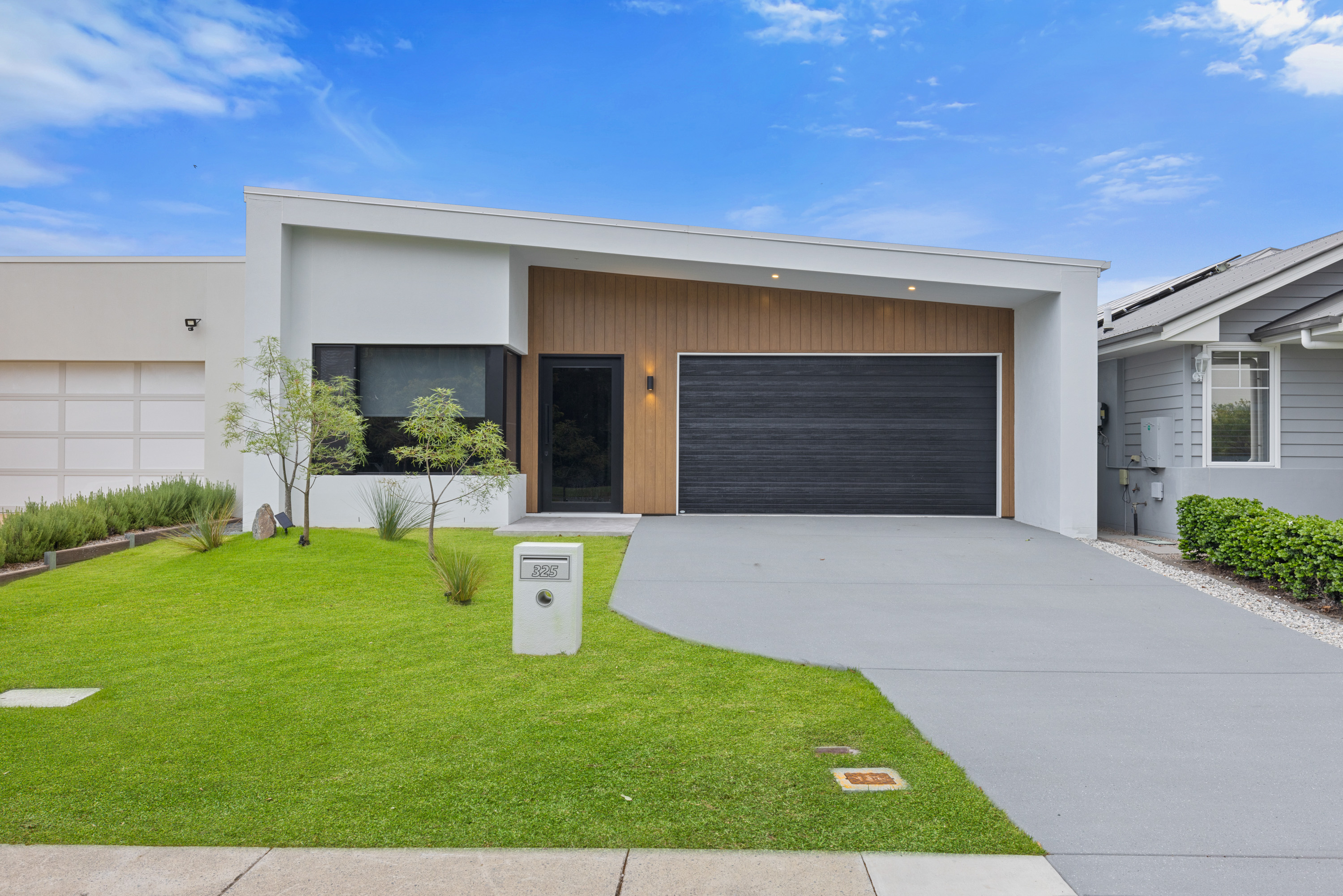 Modern single-storey home with landscaped front yard