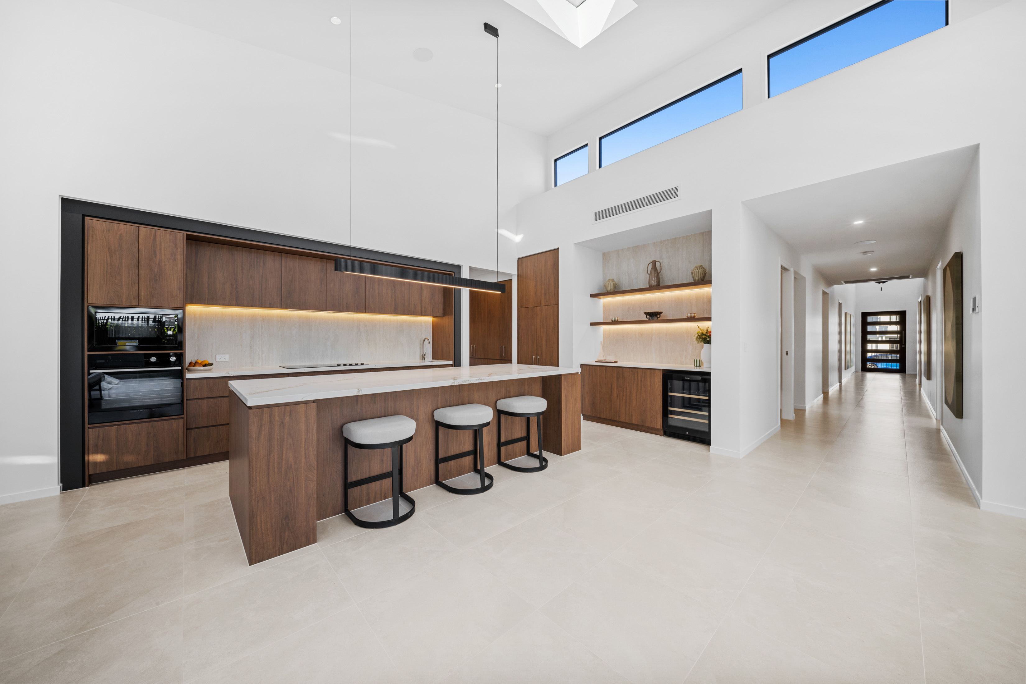 Custom home kitchen with timber cabinetry and island bench