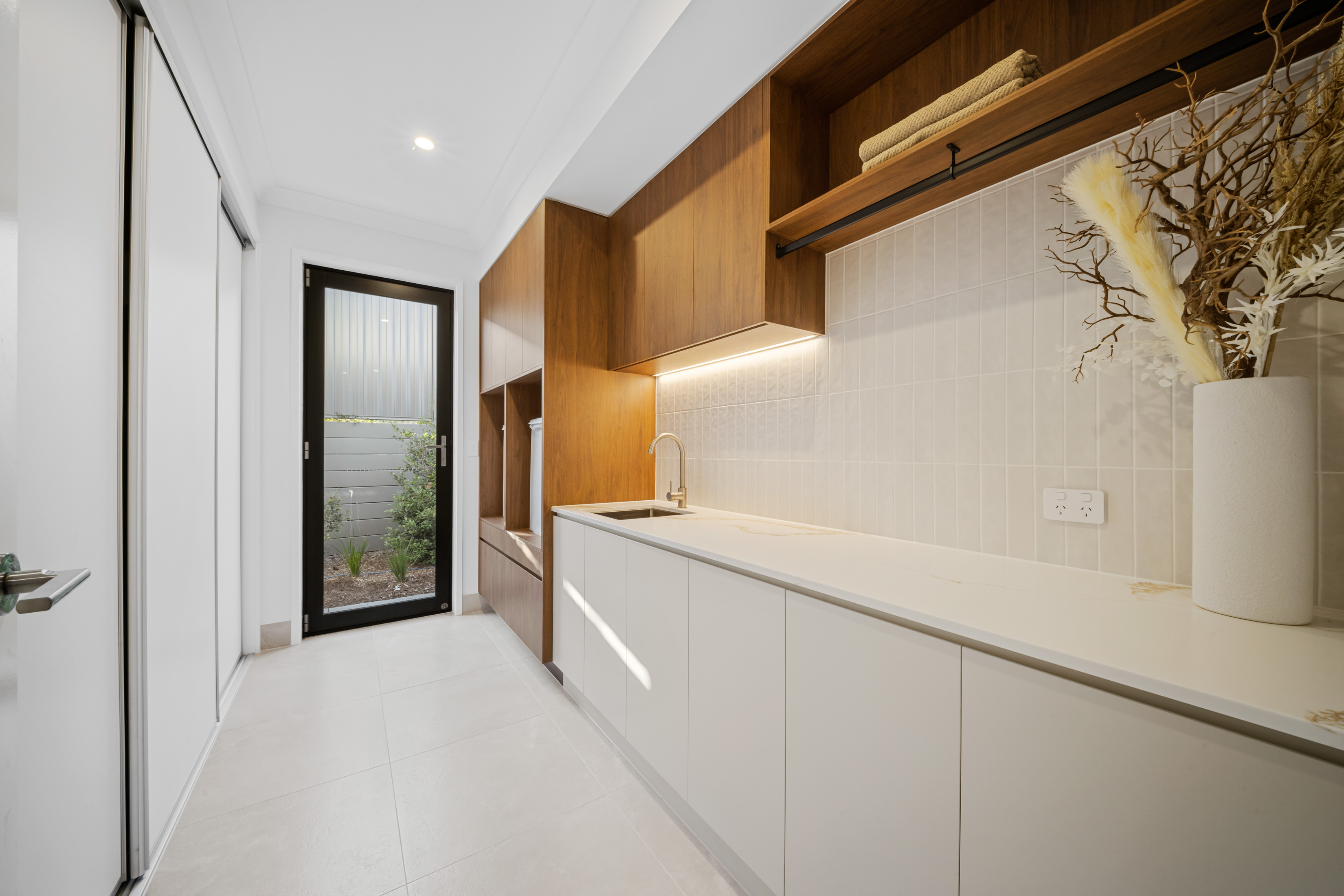 Custom home hallway with built-in timber cabinetry