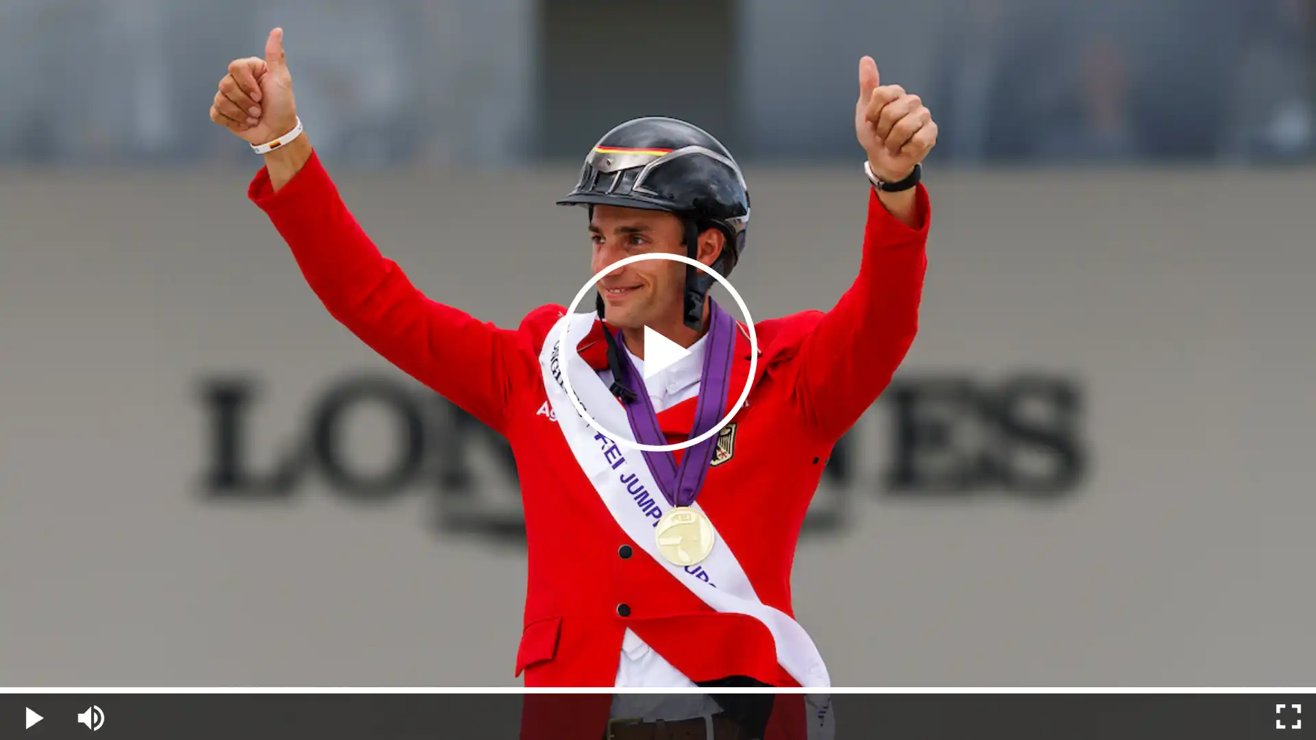 Video thumbnail showing Richard Vogel celebrating his victory at the FEI Show Jumping European Championship, arms raised with gold medal and red jacke