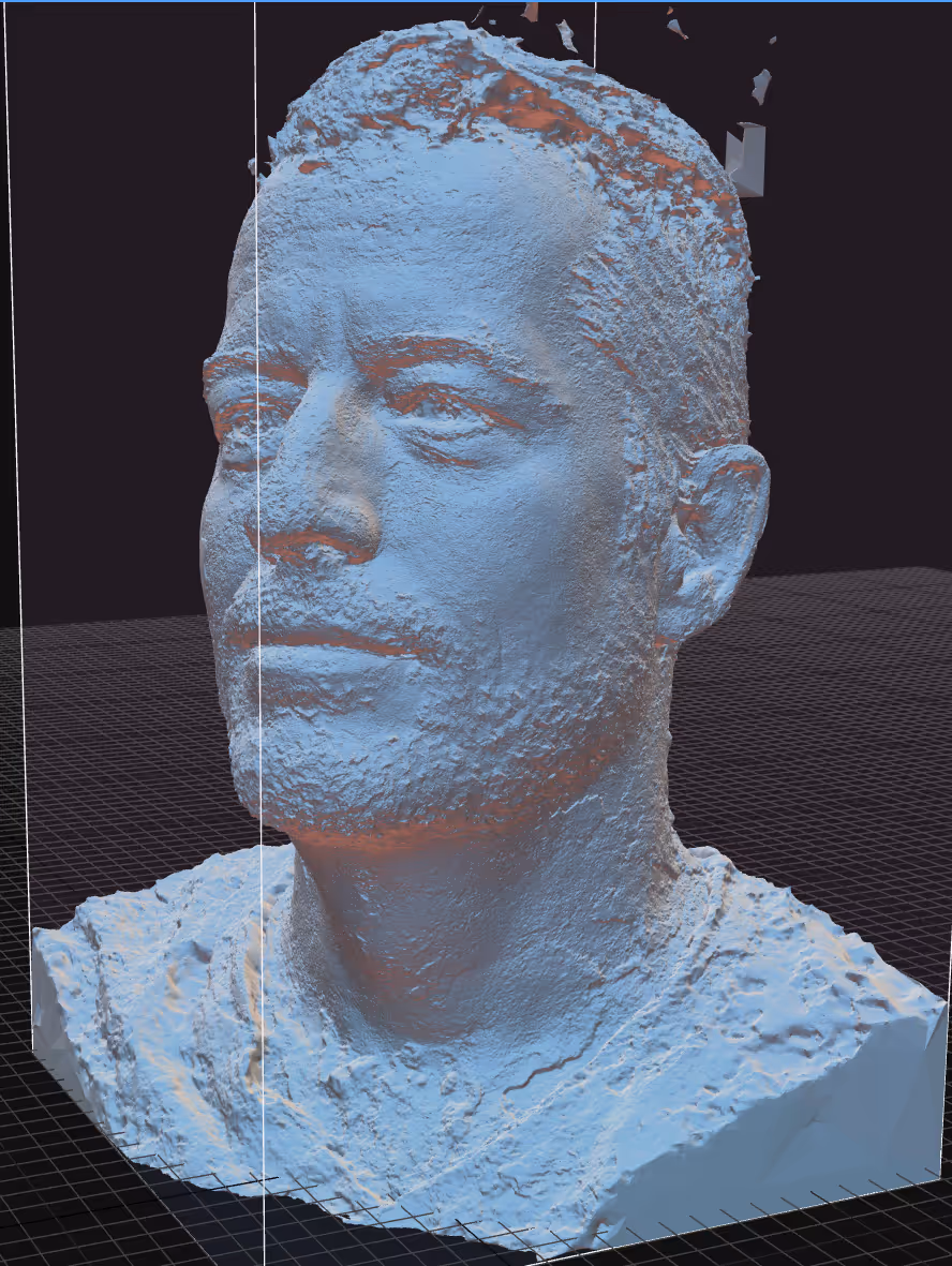 3D textured bust of a man with short hair and a beard, shown from a front-right angle on a grid background.