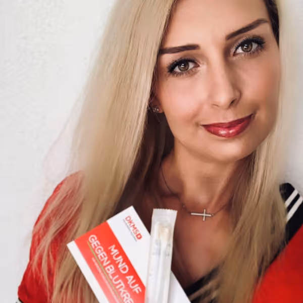 Influencer holding sponsored clothing