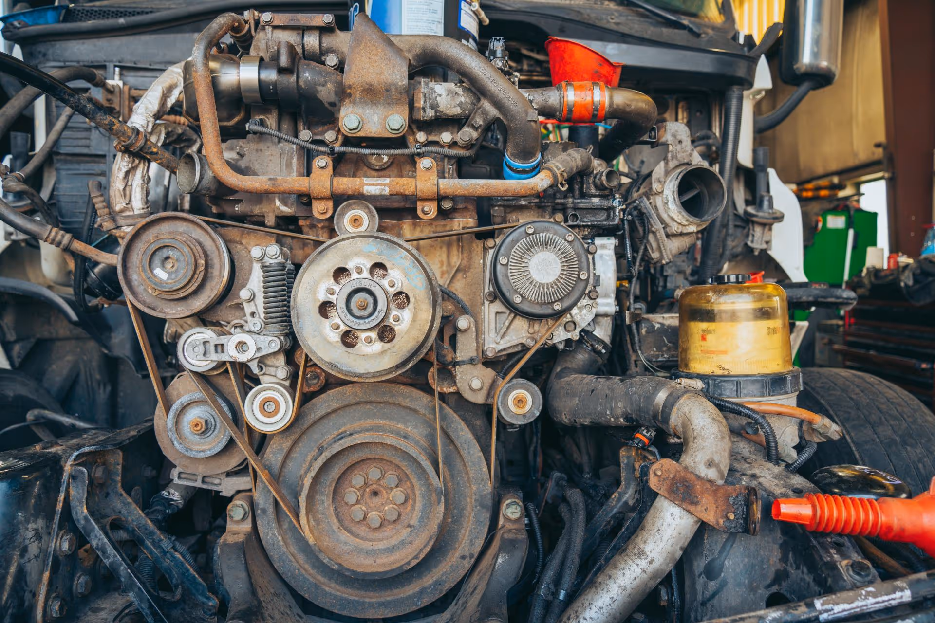 Mechanic repairing truck engine at Schroeder Truck Repair