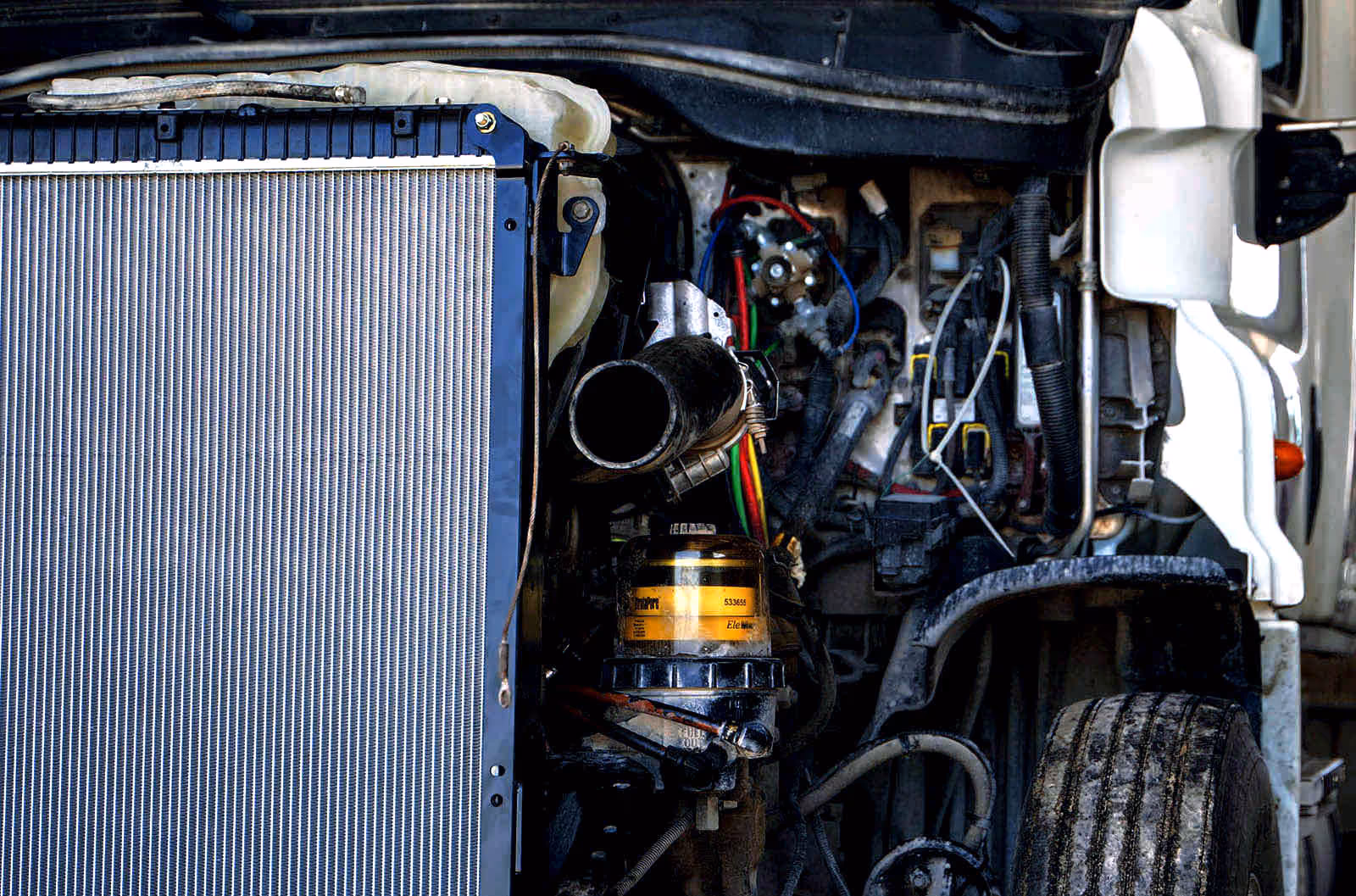 Mechanic performing truck exhaust repair at Schroeder Truck Repair