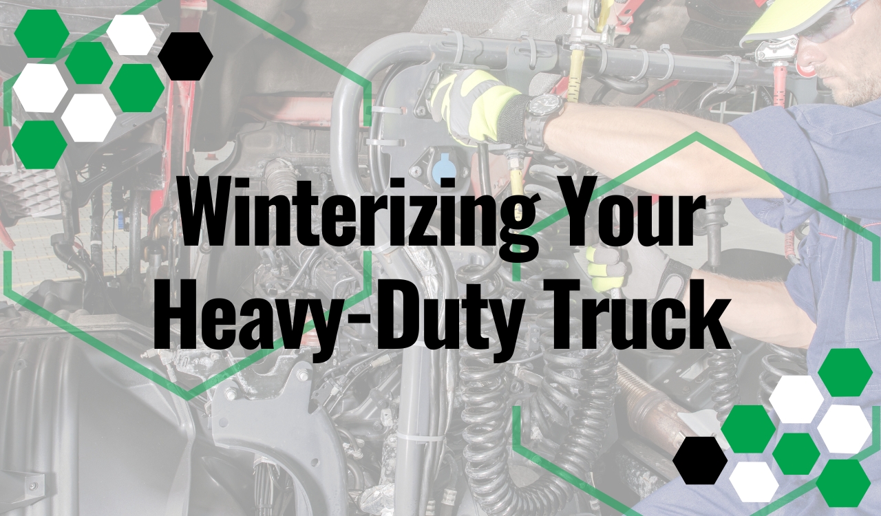 Diesel mechanic inspecting a semi truck engine before winter