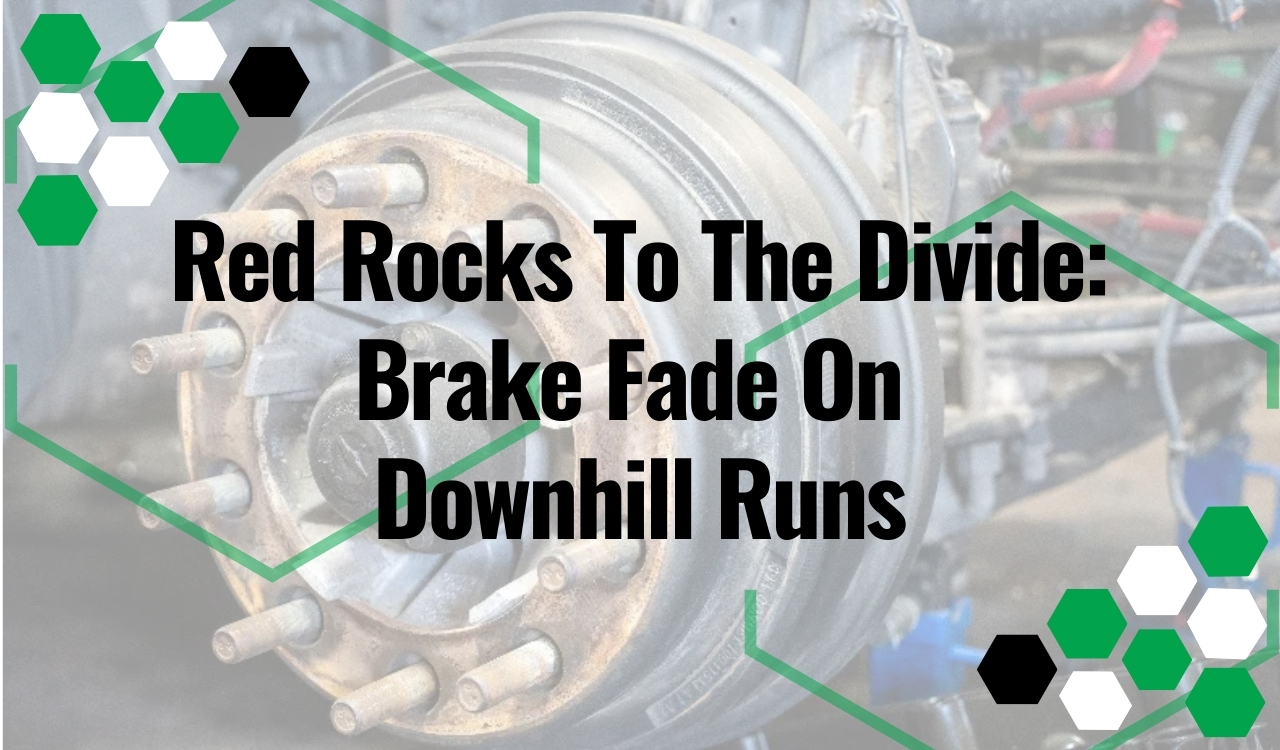 Brake repair close-up of heavy-duty truck hub and brake drum with wheel studs in shop bay.