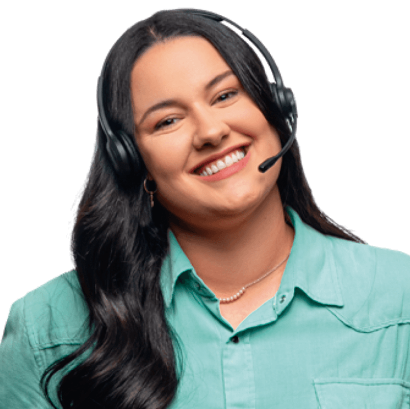Smiling woman with long dark hair wearing a teal shirt and a black headset microphone.