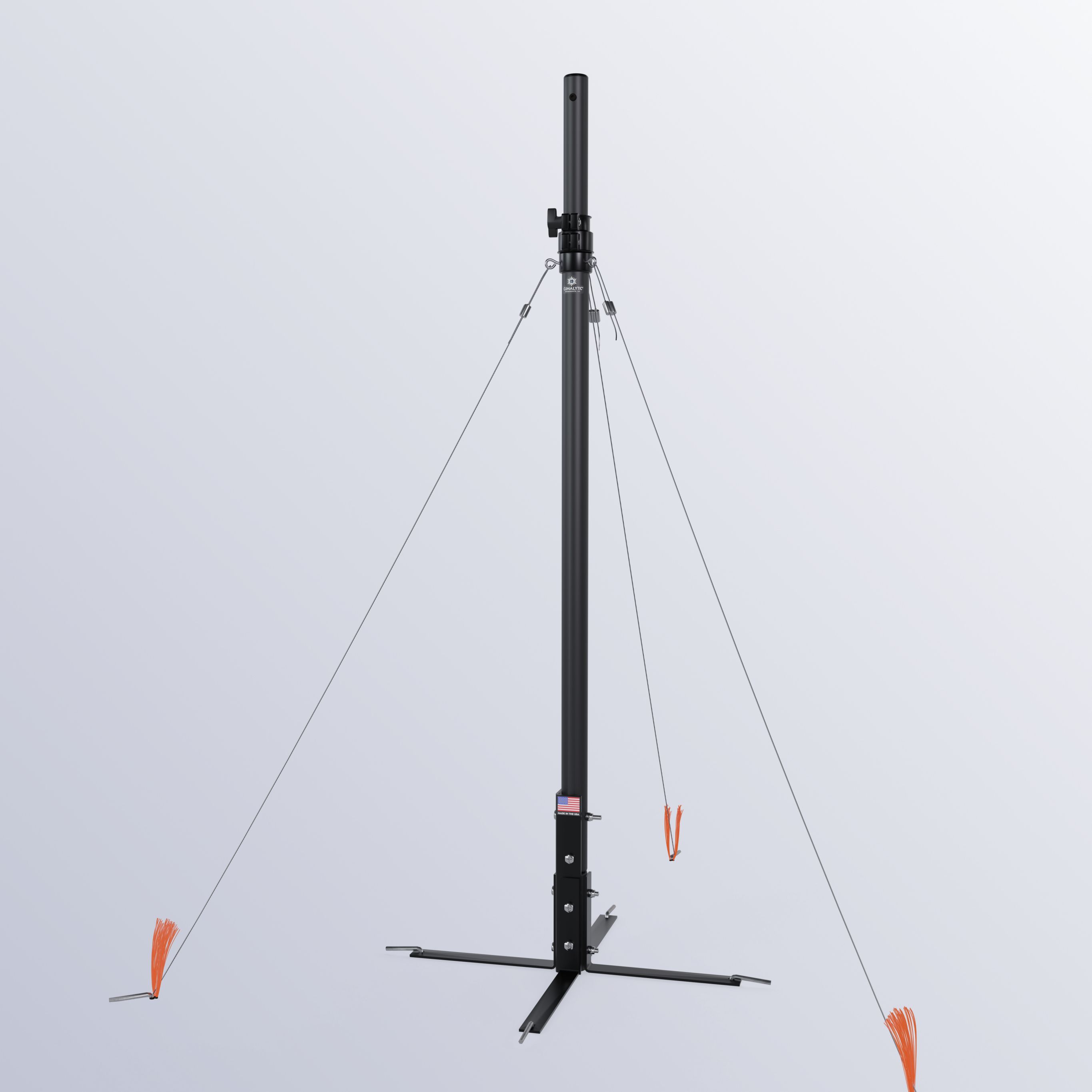 A black pole anchored to the ground.