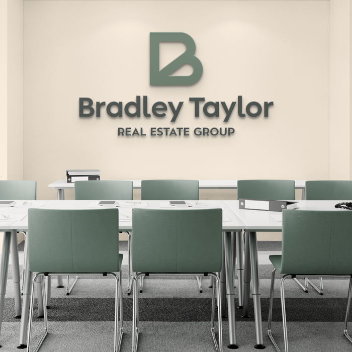 Bradley Taylor logo displayed on an office wall.