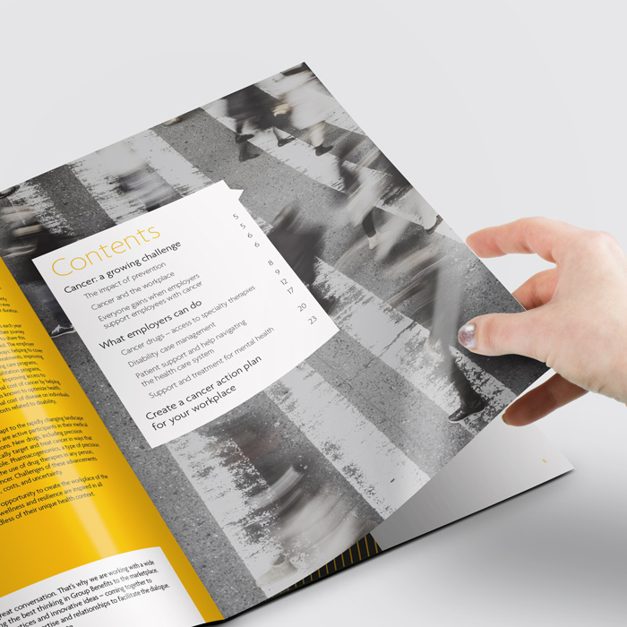 Turning the page of the Sun Life Bright Paper.