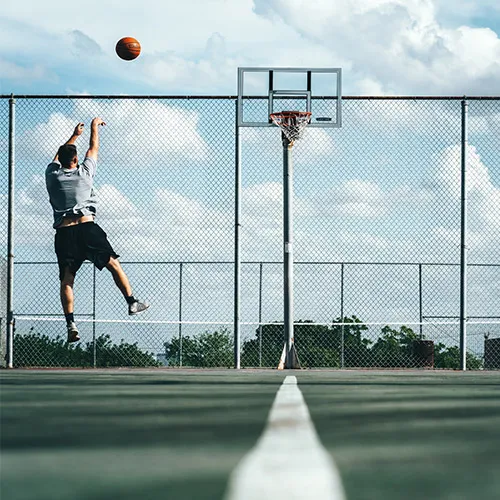 Outdoor sports area with basketball court