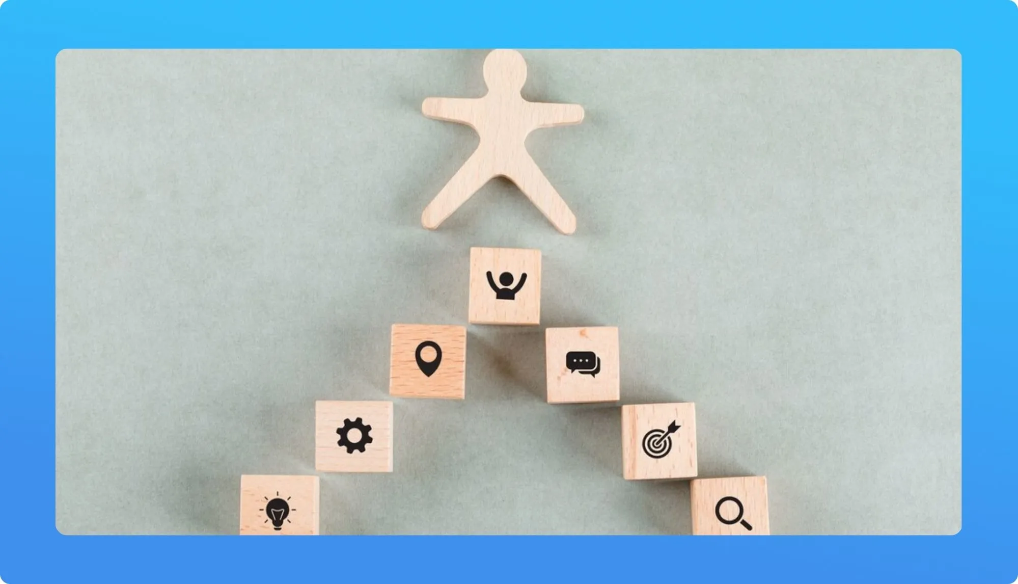 Wooden figure on a staircase of blocks with success-related icons.