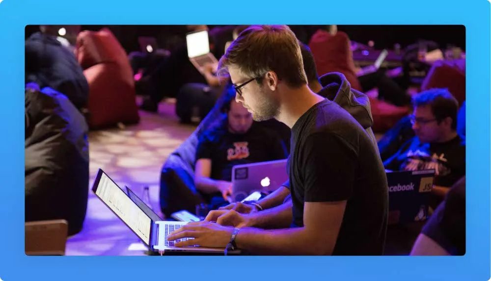 An attendee at his laptop during a tech event in Madrid