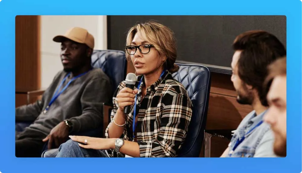 Speakers and recruiters talking during a tech event presentation in Lisbon