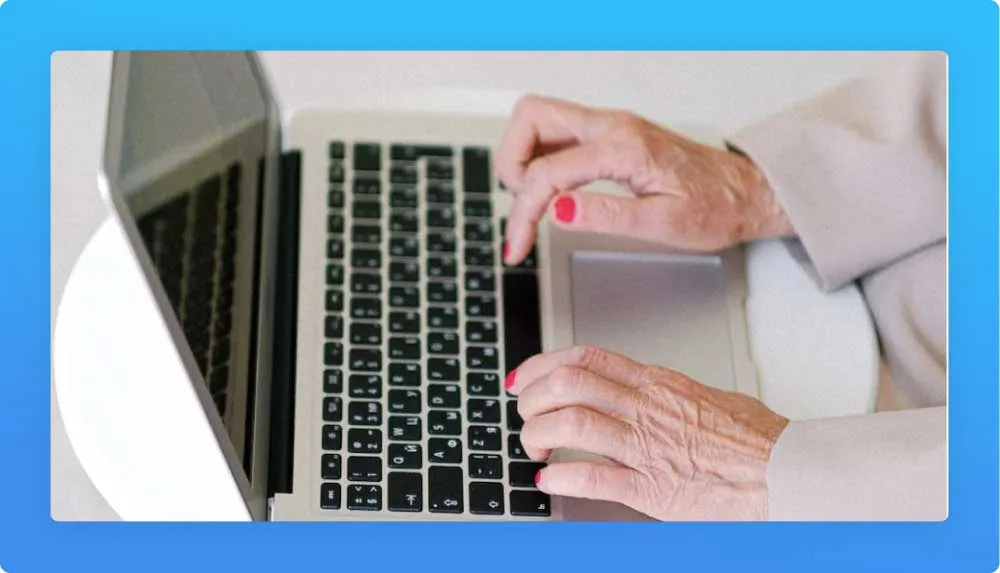 50 years old woman hands on a laptop keyboard working on her self-employed job