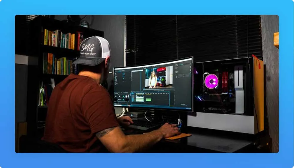 Man at computer editing a video on his studio