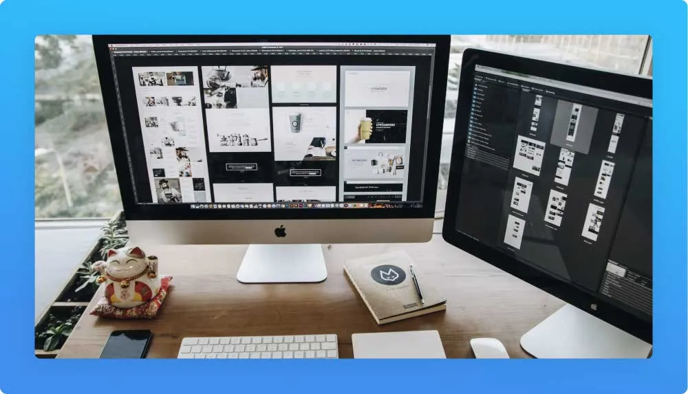 Two monitors on a desk displaying content marketing work