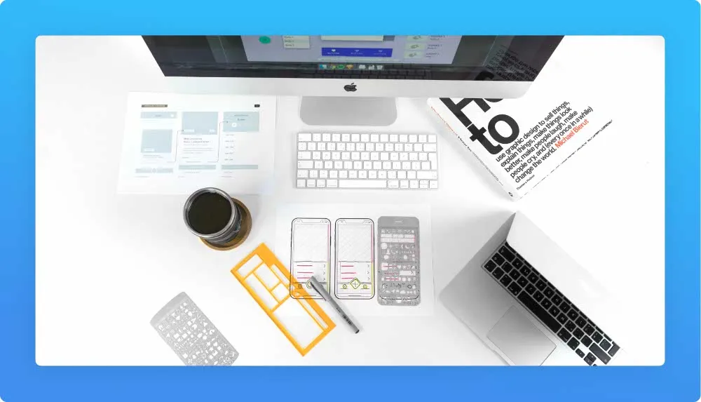 Tools, wireframe and sketches for app development, book, laptop and computer 