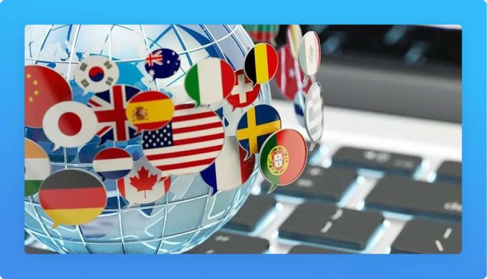 A globe with several flag form balloons, keyboard in the background