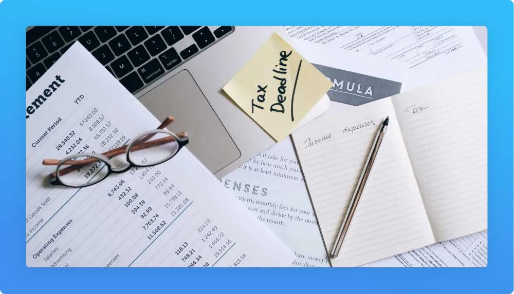 Accounting career related sheets, post-it, pen, laptop, notebook