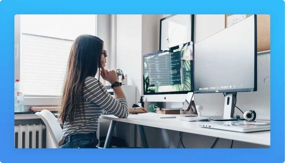 skilled citizen developer developing web solutions with her 2 monitors