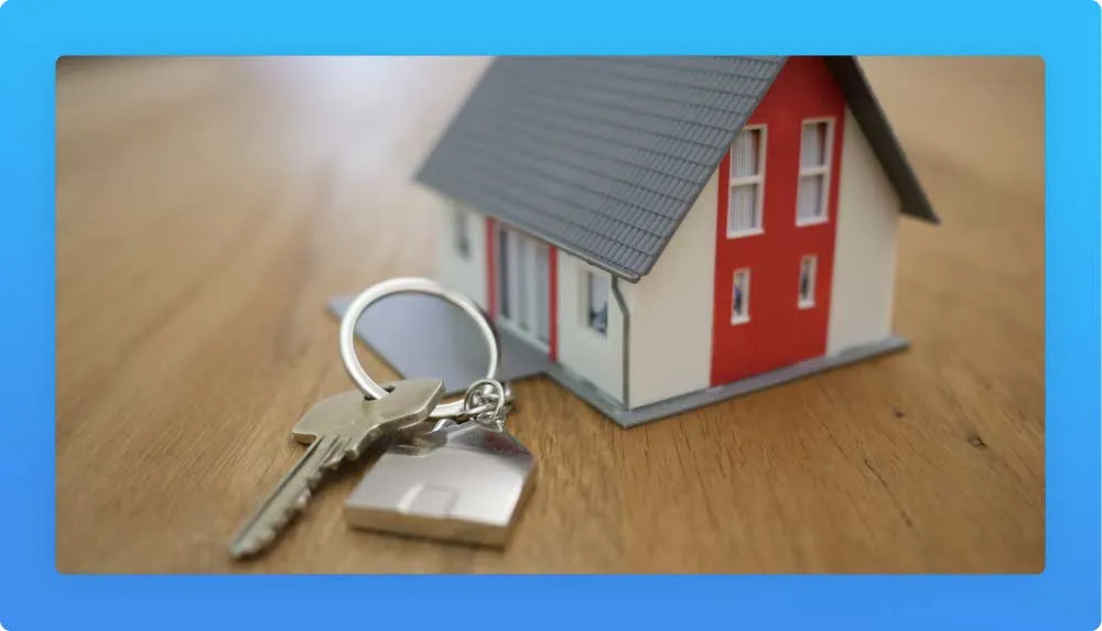 house form keychain with one key representing a real state agent career