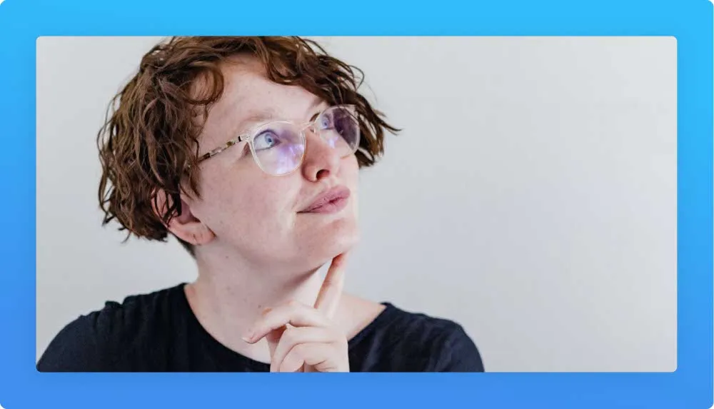 Woman with glasses looking up, reflecting upon career options