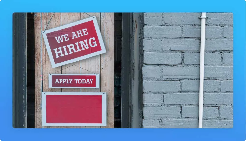 Hanged frames on door with job opening topics: "we are hiring" and "apply today"