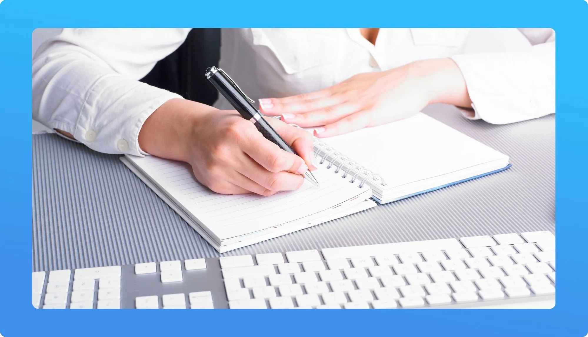 Virtual Assisant with laptop and writing in an agenda