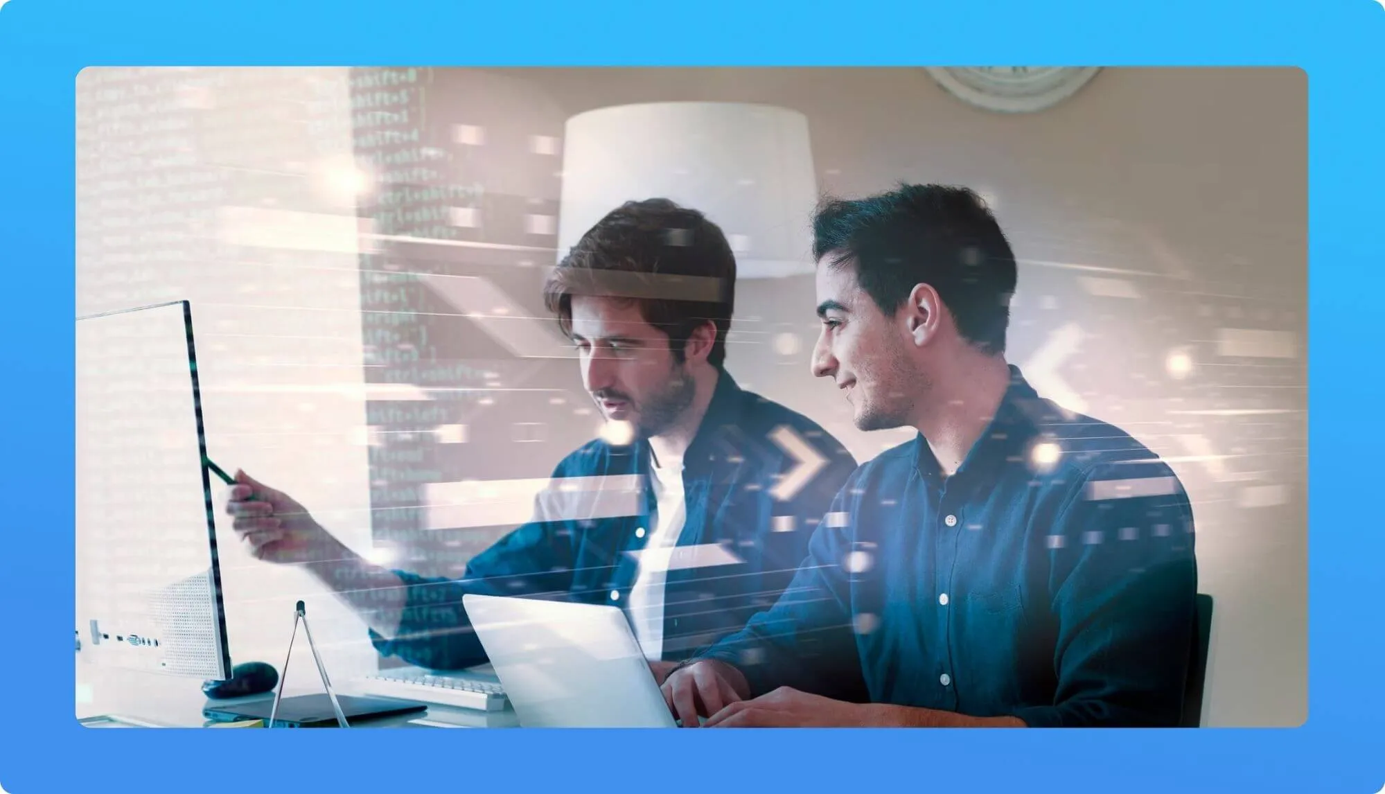 Two individuals collaborate at a desk, one pointing at data on a computer screen, with graphic overlays of digital code in the background.