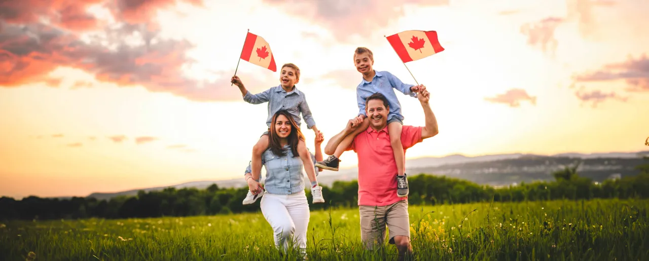 Child on shoulder with Canadian flag