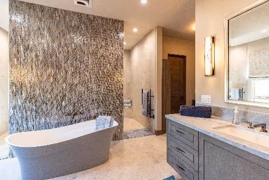 A bathroom with a tub and sinkAI-generated content may be incorrect.